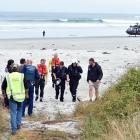 Emergency services at the scene of the Taieri Mouth boating accident that left one child dead and...