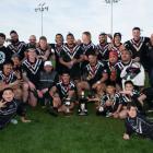 Jed Lawrie (white hat) and the Hornby Panthers after winning the Pat Smith Trophy on Sunday....