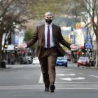Embracing a one-way future for George St is Dunedin Mayor Aaron Hawkins, approaching the Octagon...