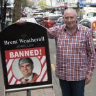 Brent Weatherall, a George St retailer, makes clear how he feels about the Dunedin City Council’s...