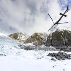 Helicopter leaving Franz Josef Glacier. Photo: Getty Images