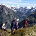 Visitors hike over MacKinnon Pass, in Fiordland. It is proposed the pass be renamed. PHOTO:...