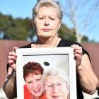 Joanne Watson, holding the last photo taken of her and her mother Nancye MacKenzie, says the...