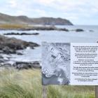Signs at Ocean Beach in Bluff warn of the presence of asbestos.PHOTO: LAURA SMITH

