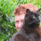 Te Anau resident Sue Peoples with her late cat Jac. PHOTO: SUPPLIED