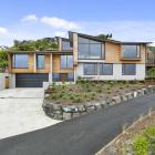 This Dunedin home was designed to capture views of St Clair beach but sit below the view line of...