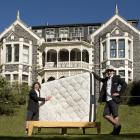 Showing off one of the beds sold to students in Dunedin by The FlatPack are Bryn Fredheim (left)...