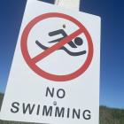 A no swimming sign has been installed near a beach north of Timaru after a man drowned earlier...