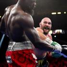 Tyson Fury (right) landed a flurry of punches in the 11th round, finally knocking out Deontay...