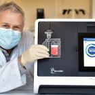MicroGem chief scientific officer Dr David Saul shows the Covid-19 saliva test which the business...