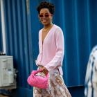 A printed maxi dress is styled with a soft pastel oversized cardi and accessorised with flashes...