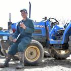 Outram farmer Graeme Young takes  time to stop and smell the coffee at an auction of farm...