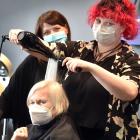 Adult learning awards recipient, hairdressing educator Sara Ellis, watches as fellow recipient,...