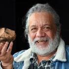 Miner and geologist Harry Albert, of Milton, holds what he believes may be a meteorite,...