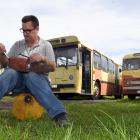 Otago Heritage Bus Society mechanic Anthony Holliday tinkers with a starter motor ahead of a trip...