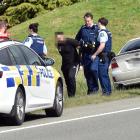 A man is arrested at the side of State Highway 1, south of Waitati, yesterday  about 4pm. PHOTO:...