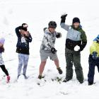 Having a snow fight on the Naseby Recreational Reserve yesterday are (from left) Macy Harmes (6),...