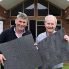 Exhibiting wool carpet tiles before speaking at a roadshow stop at Lawrence Golf Club last week...