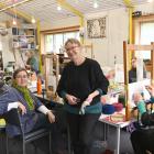 Loom Room owner Christine Keller (seated at left) and tapestry artist Marilyn Rea-Menzies at the...