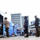 People queue for the vaccine bus in the Octagon in Dunedin. PHOTO: PETER MCINTOSH