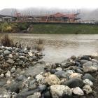 Water overflows from the Alpha Series One stormwater pond into the Otago Fish &amp; Game wetlands...