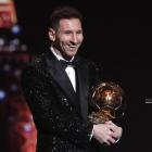 Lionel Messi with the Ballon d'Or award. Photo: Reuters