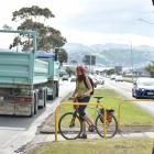 Spokes committee member Heike Cebulla-Elder navigates the busy Portsmouth Dr bicycle crossing...