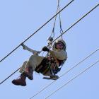 Contractor Gene Peters works on transmission lines in the Grebe Valley, near Manapouri. PHOTOS:...