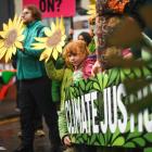One of the inheritors of the decisions made at Cop26 joins a protest outside the entrance to the...