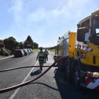 Firefighters at the scene this morning. Photo: Laura Smith