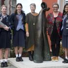 Otago Girls’ High School staff and pupils (from left) prefect Jemma Tutty, holding a time capsule...