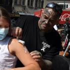Applying a temporary tattoo to Amy Houseman is White Ribbon lower South Island ambassador Jamie...