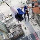 A base jumper leaps from the 28-floor Martinelli Building in Sao Paulo, Brazil. PHOTO: REUTERS