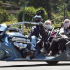 Powering around the suburbs of Dunedin are (from left) driver Murray McKenzie, Shirley Erwin,...