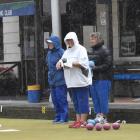 Taieri lead Jenny Dyhrberg delivers her bowl in the midst of a downpour during the Bowls Dunedin...