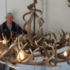 Jeff Hylton and a partly completed chandelier. PHOTO: GUY WILLIAMS