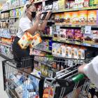 Kimberley Rosenbrock furiously clears the shelves of Port Chalmers Four Square during a 90-second...