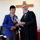 Sun Yi Tao (17) is presented an award by St Kevin’s College principal Paul Olsen. Yi Tao was...