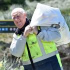 Hauling a full sack of litter back to the Ocean View Recreational Reserve is Stephen Jory, of...