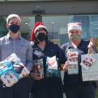 ANZ Mosgiel staff (from left) Jordie Beres, Robyn Green and Jill Day hold some of the presents...