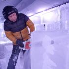 Sculptor Victor Cagayat cuts through a block of ice at Queenstown Ice Bar this week. PHOTO: GUY...