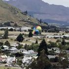 A Sunrise Balloons hot-air balloon lands at Queenstown Airport yesterday. PHOTO: SUPPLIED