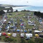 A substantial crowd, stalls and food caravans intermingle at the Brighton Domain yesterday. PHOTO...