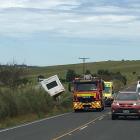 A ute and caravan came off SH1 and came to rest in a paddock this afternoon. Photo: Richard Davison