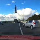 This is the frightening moment a car lost control and went slamming into the road barrier on SH1....