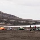 A scientific expedition set up camp on loose rock from the 2014-15 eruption near the cliffs of...