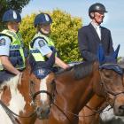 Mounted police officers (from left) Olivia Winbush, on Jericho, Melissa Wallace, on Maotai, and...