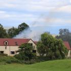 Smoke can be seen from a house fire near Maheno. Photo: Kayla Hodge