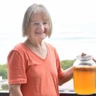 Brighton resident Maureen Marshall and a jar of kombucha with a scoby floating on the top. PHOTO:...