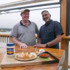 The FishWife co-owner John Pile, of Moeraki, and TV chef Ganesh Raj enjoy a meal. PHOTO: RUBY...